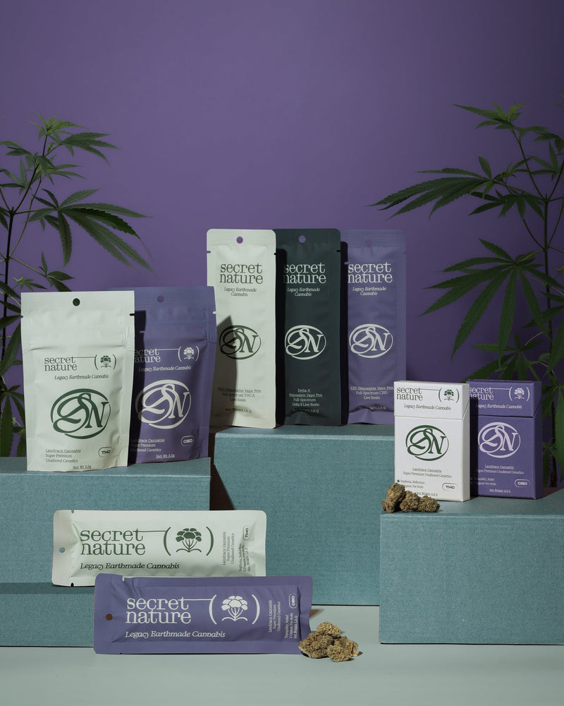Premium cannabis flower and pre-roll packaging displayed against a purple background